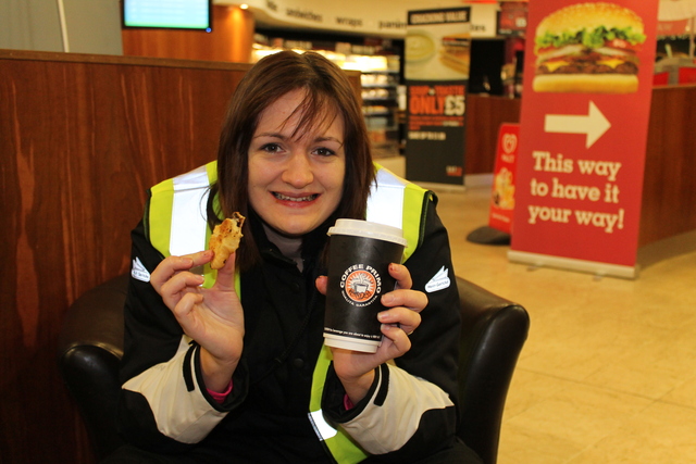 Kelly enjoying a coffee and pastry