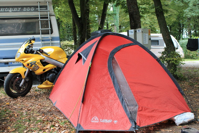 Our Triumph parked on sea of tents as far as the eye could see